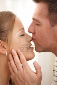 8747892-man-kissing-happy-woman-s-nose-and-stroking-neck-with-eyes-closed-in-closeup